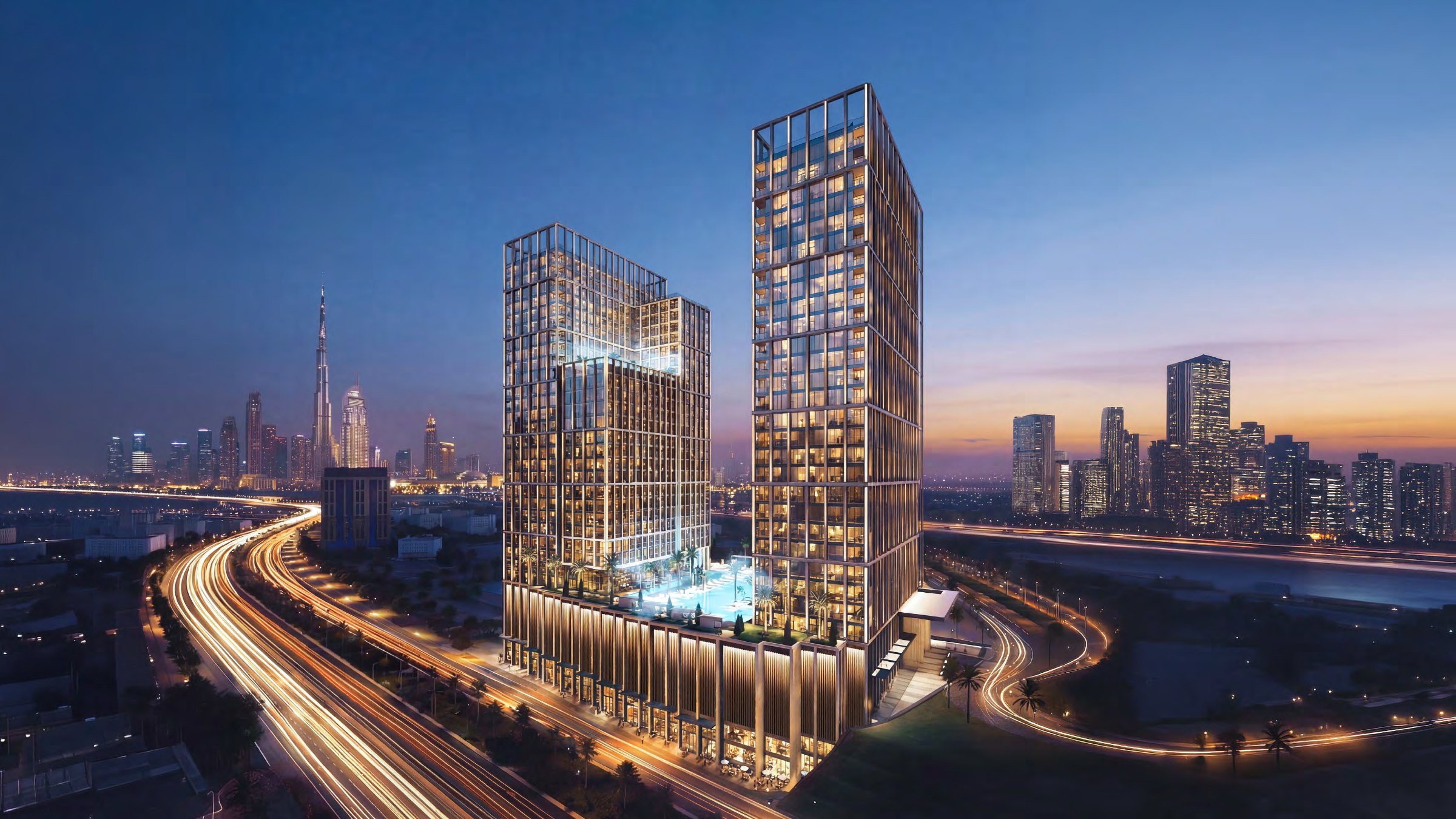 Binghatti Spectre twin towers at dusk above Al Khail Road